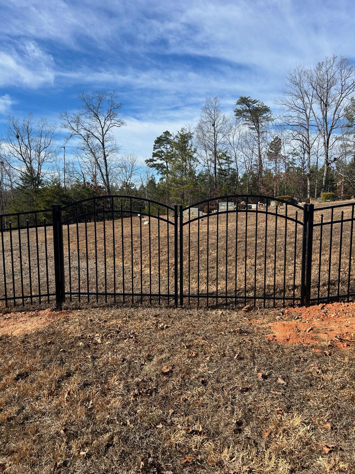 ornamental metal fence installed by top rail fence