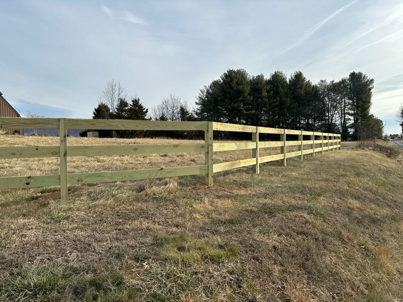 wood ranch rail fence installed by top rail fence