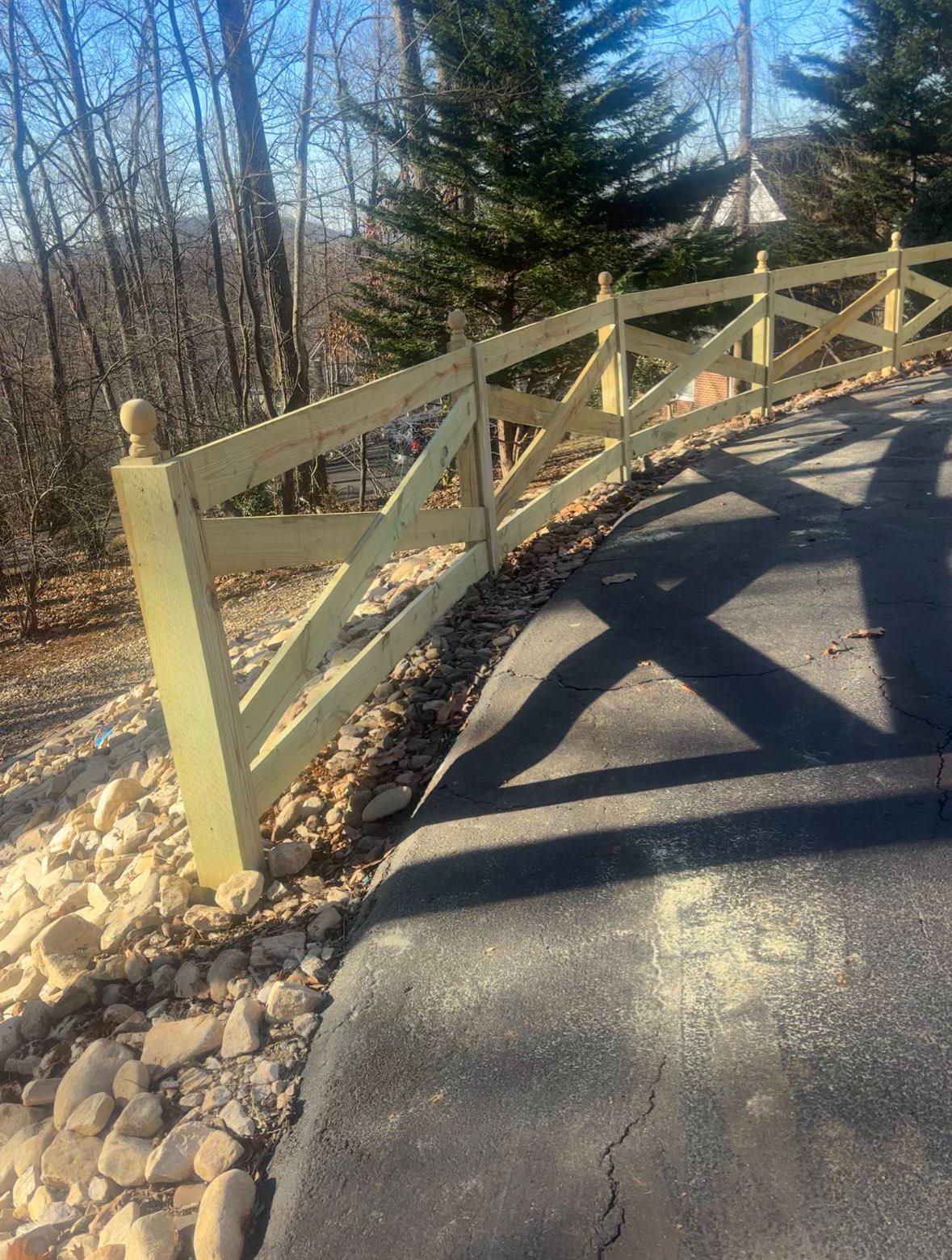 wood ranch rail fence installed by top rail fence