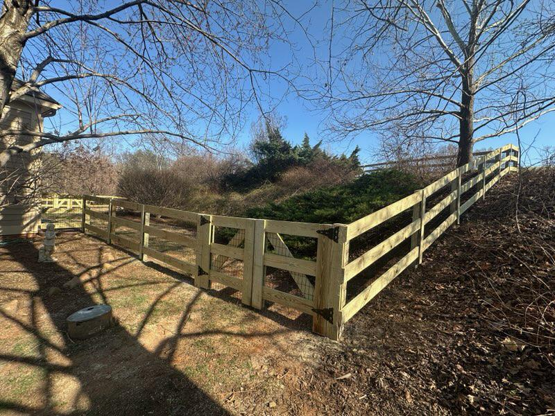 wood ranch rail fence installed by top rail fence