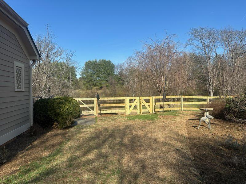 wood ranch rail fence installed by top rail fence