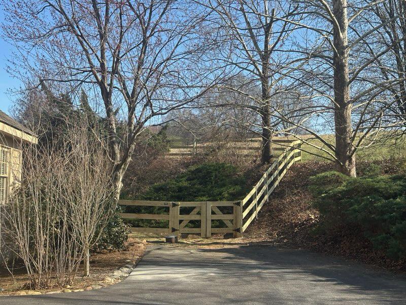 wood ranch rail fence installed by top rail fence