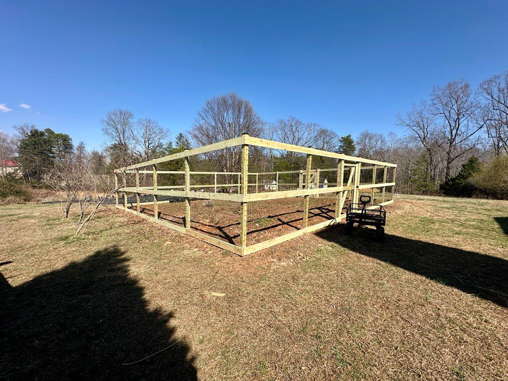 wood ranch rail fence installed by top rail fence