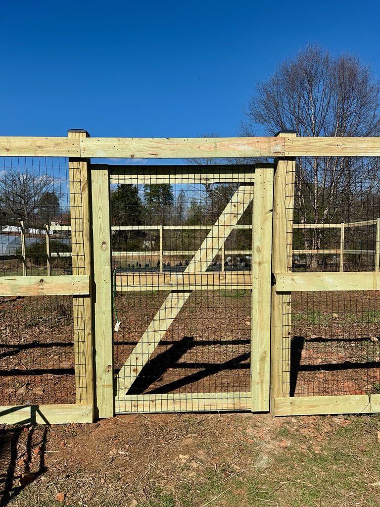 wood ranch rail fence installed by top rail fence