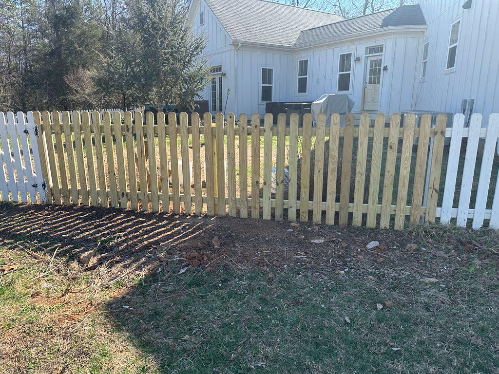wood picket fence installed by top rail fence
