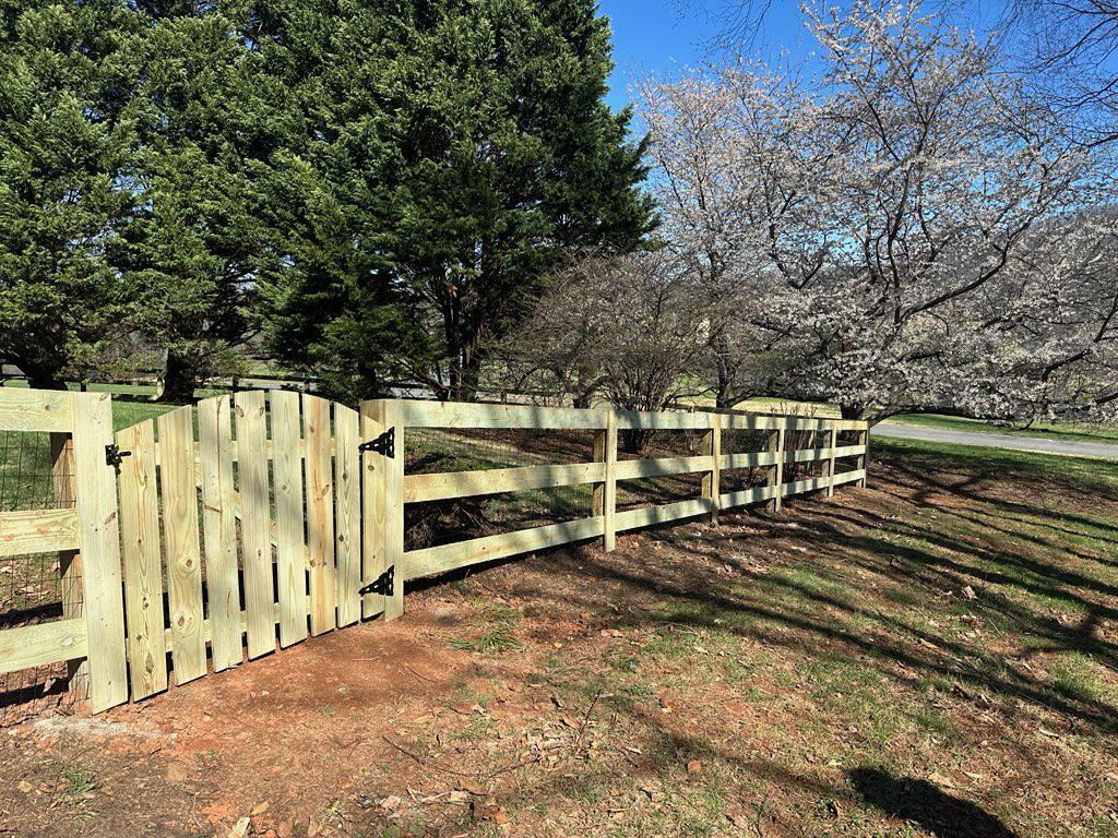 wood ranch rail fence installed by top rail fence