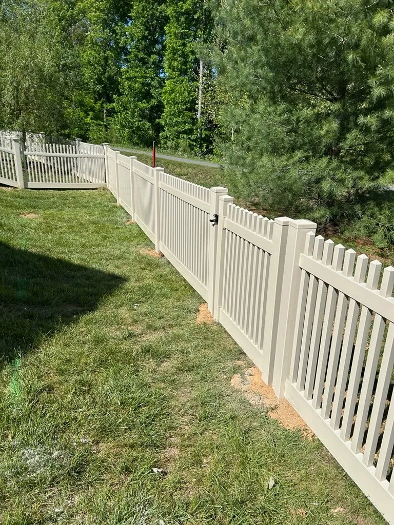 vinyl picket fence installed by top rail fence