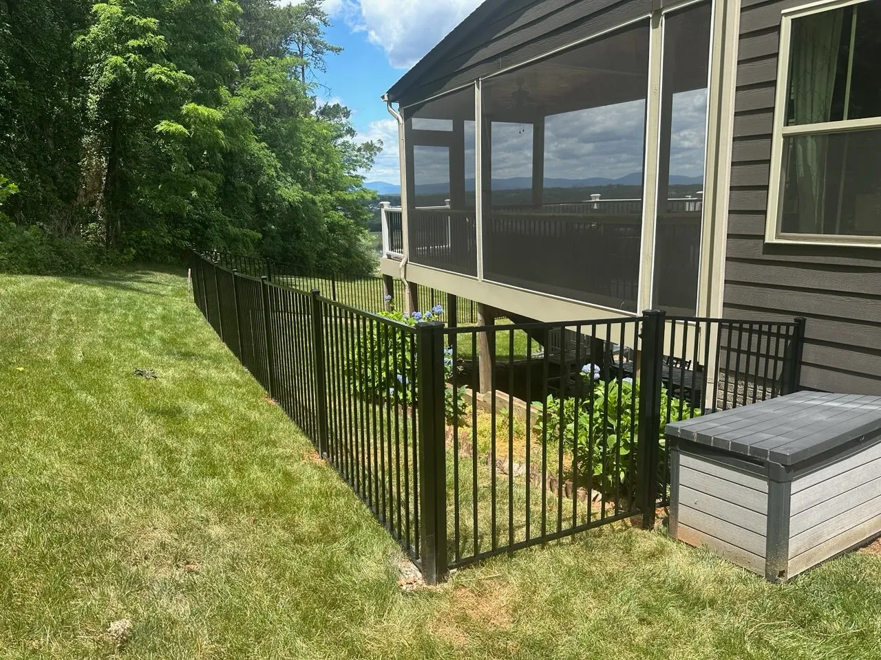 two rail ornamental metal fence installed by top rail fence