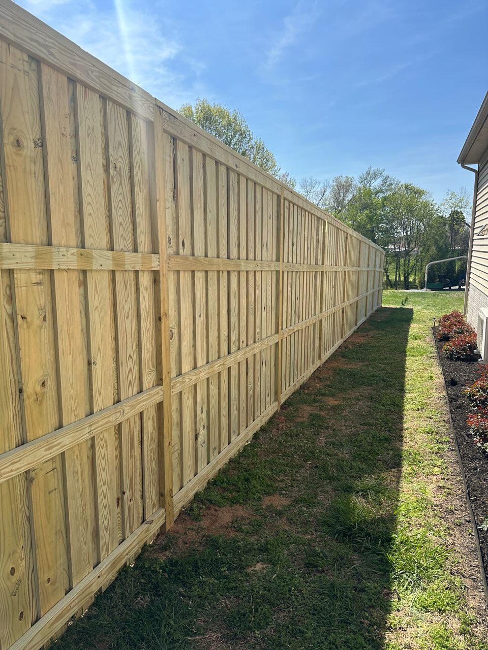 wood board on board fence installed by top rail fence