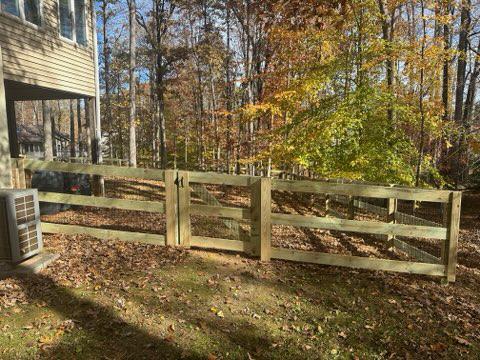 wood ranch rail fence installed by top rail fence