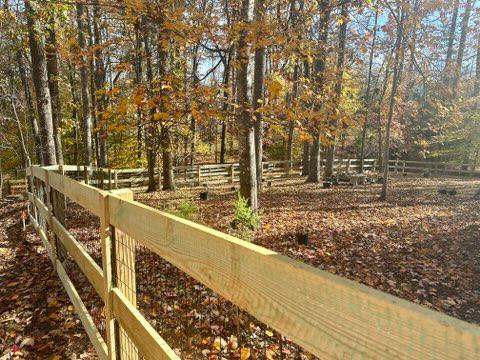 wood ranch rail fence installed by top rail fence