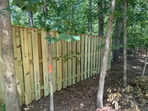 wood shadowbox fence installed by top rail fence