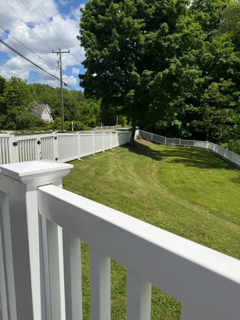 vinyl picket fence installed by top rail fence