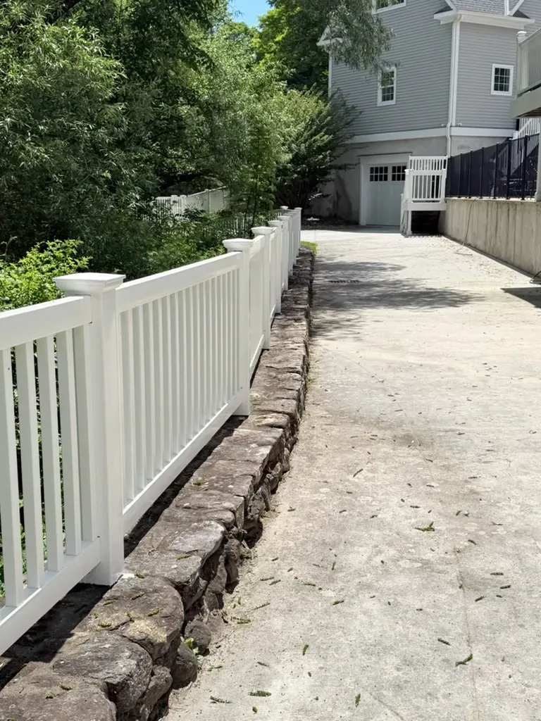 vinyl picket fence installed by top rail fence
