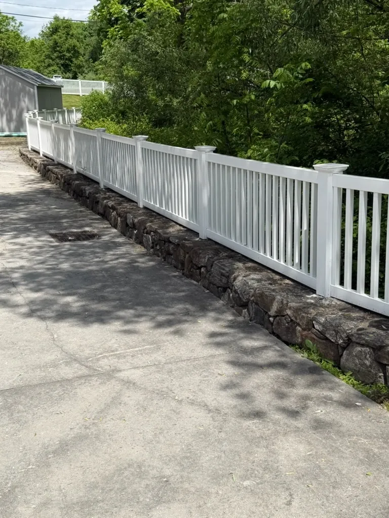 vinyl picket fence installed by top rail fence