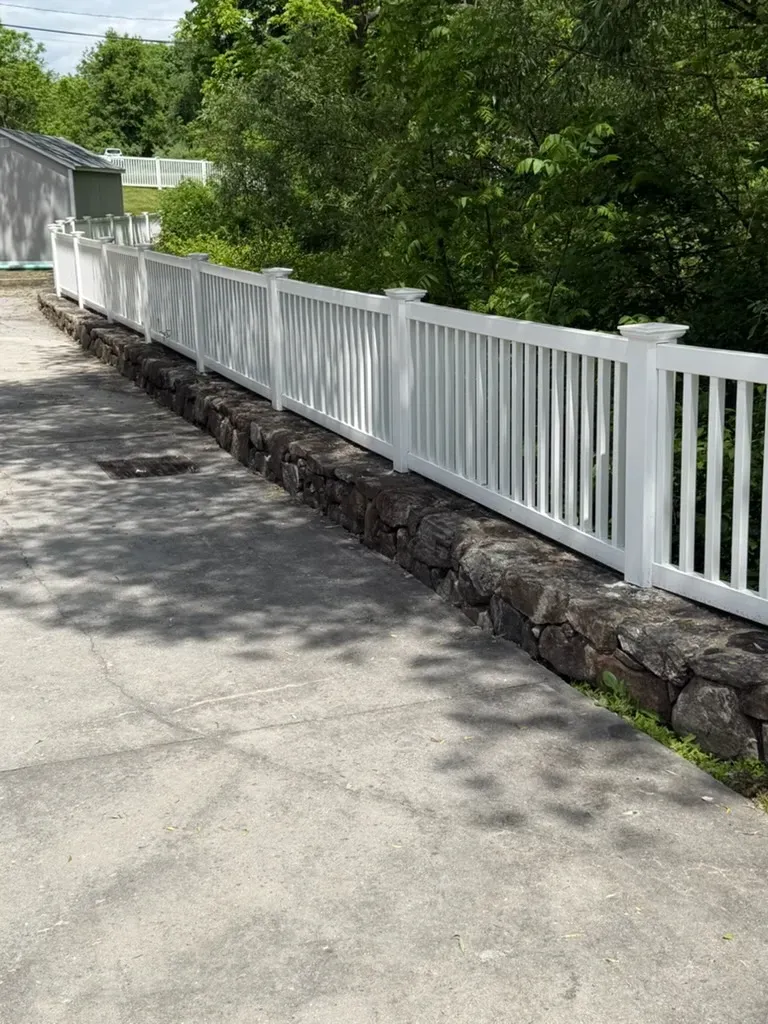 vinyl picket fence installed by top rail fence