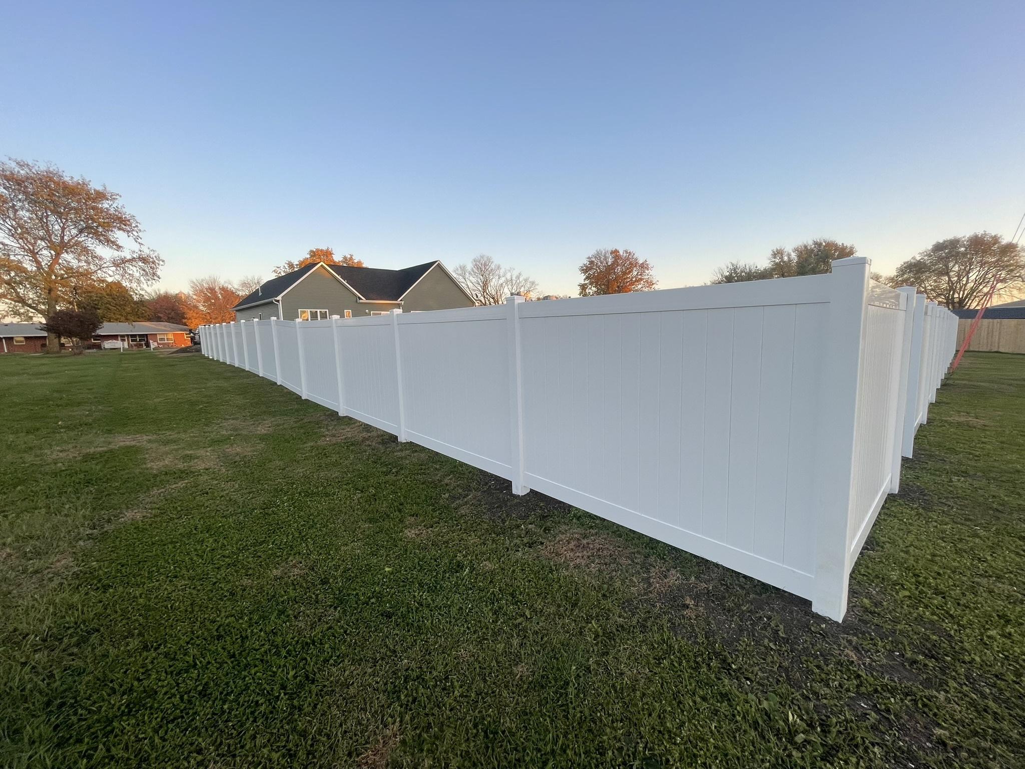 vinyl privacy fence installed by top rail fence