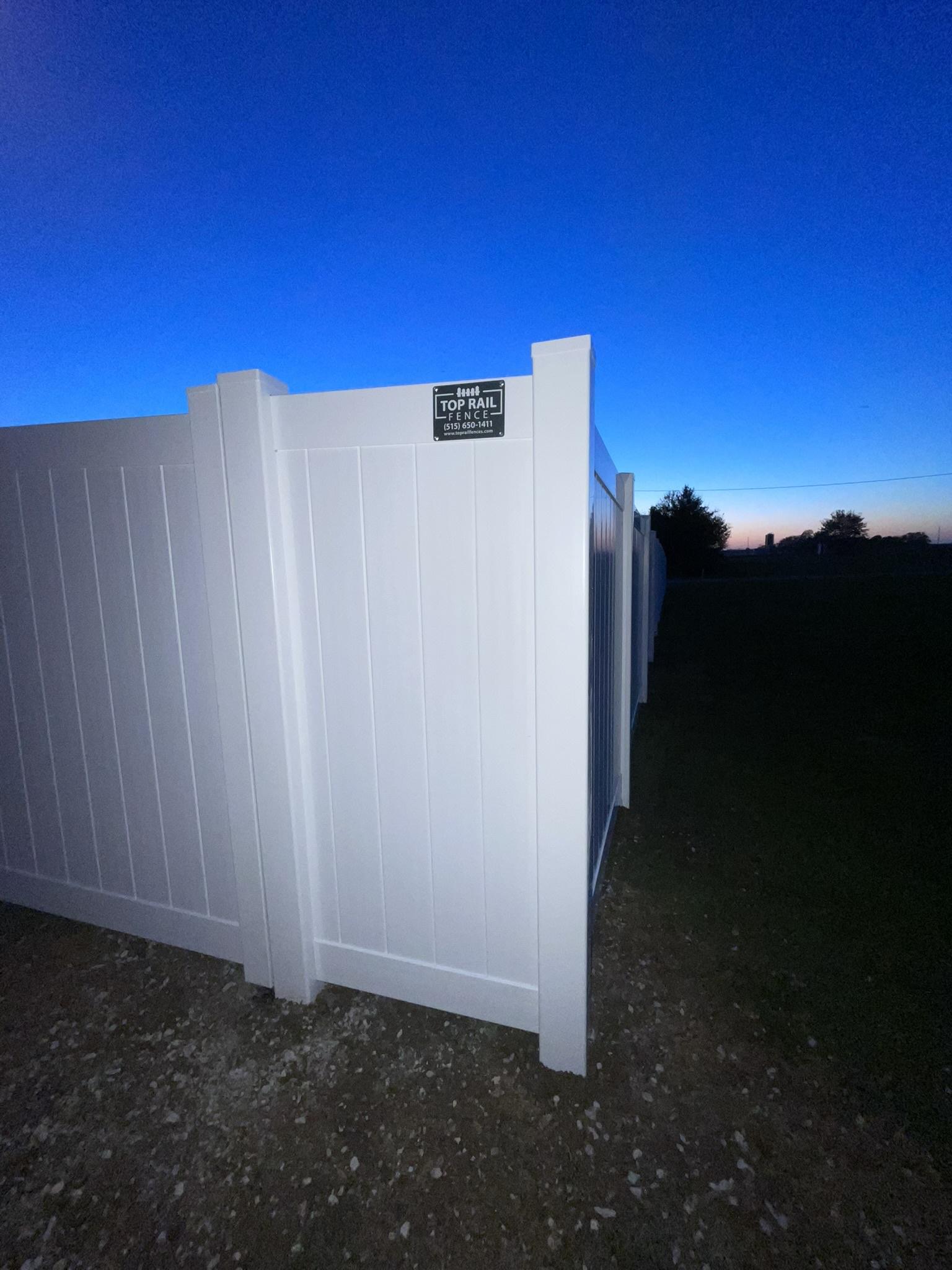 vinyl privacy fence installed by top rail fence
