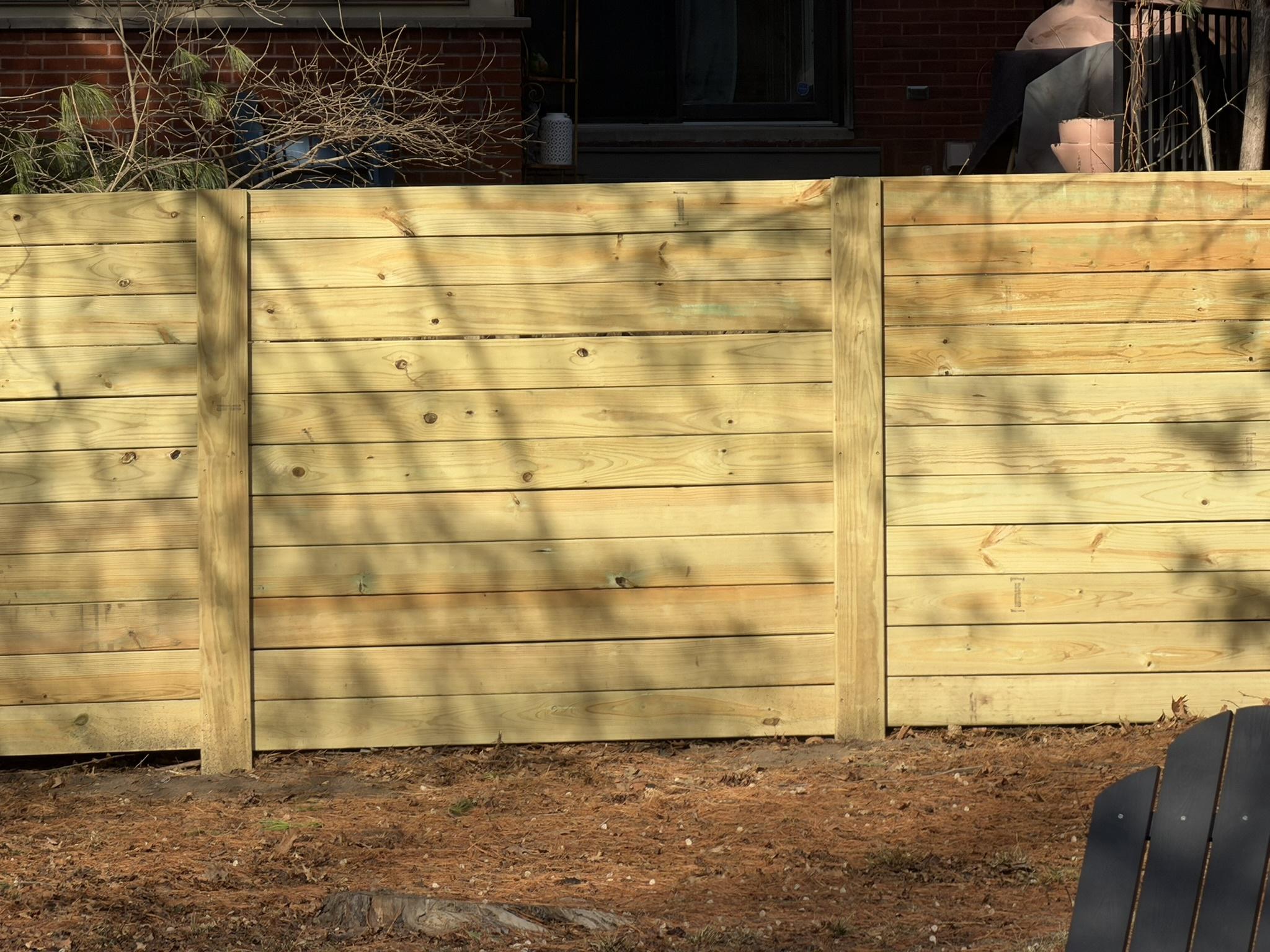 wood horizontal fence installed by top rail fence
