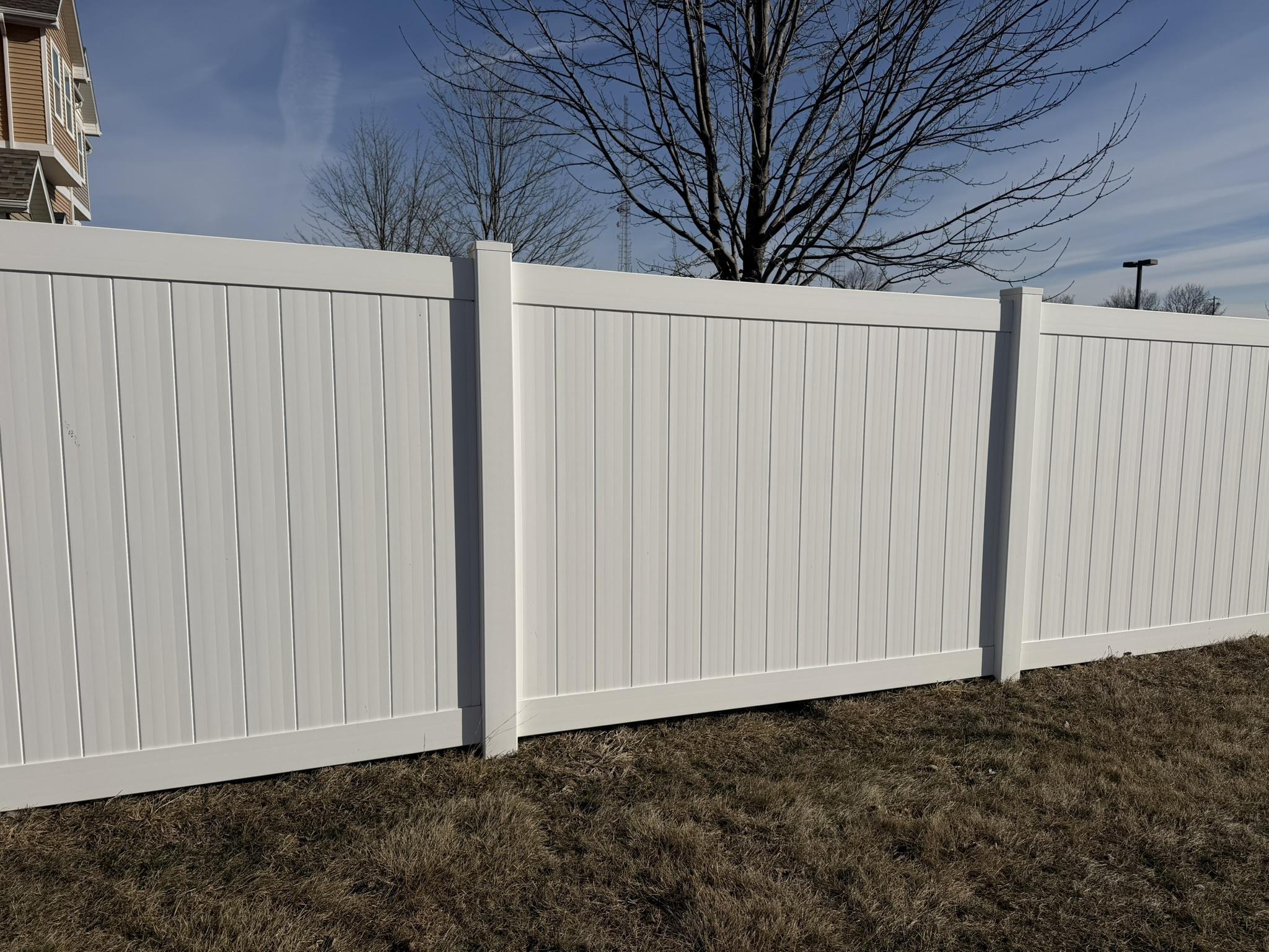 vinyl privacy fence installed by top rail fence