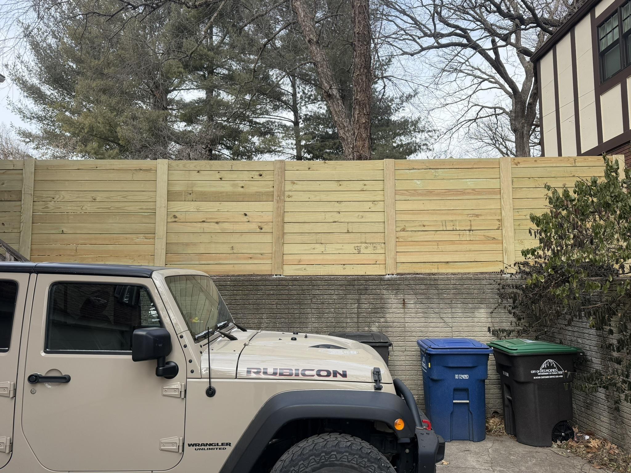 wood horizontal fence installed by top rail fence