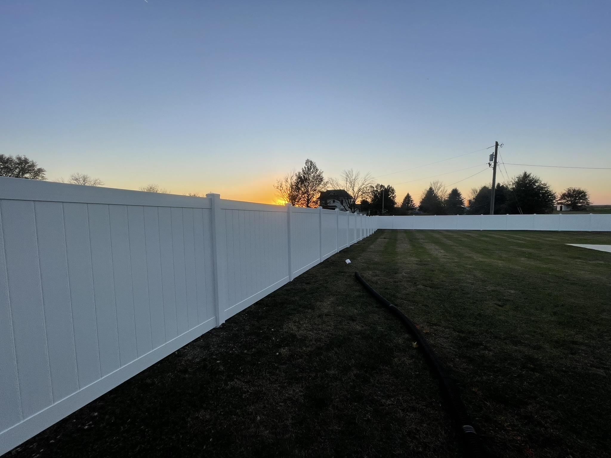 vinyl privacy fence installed by top rail fence
