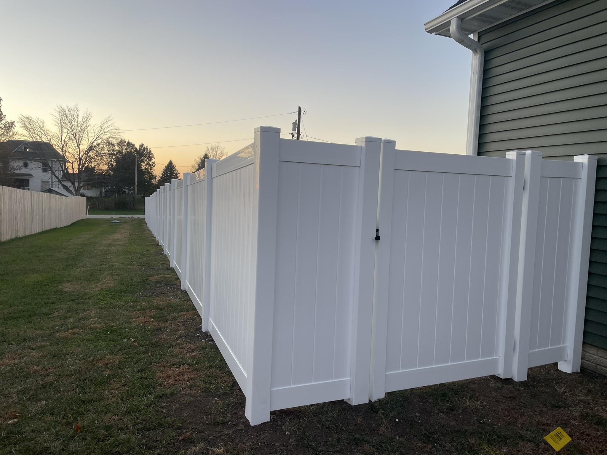 vinyl privacy fence installed by top rail fence