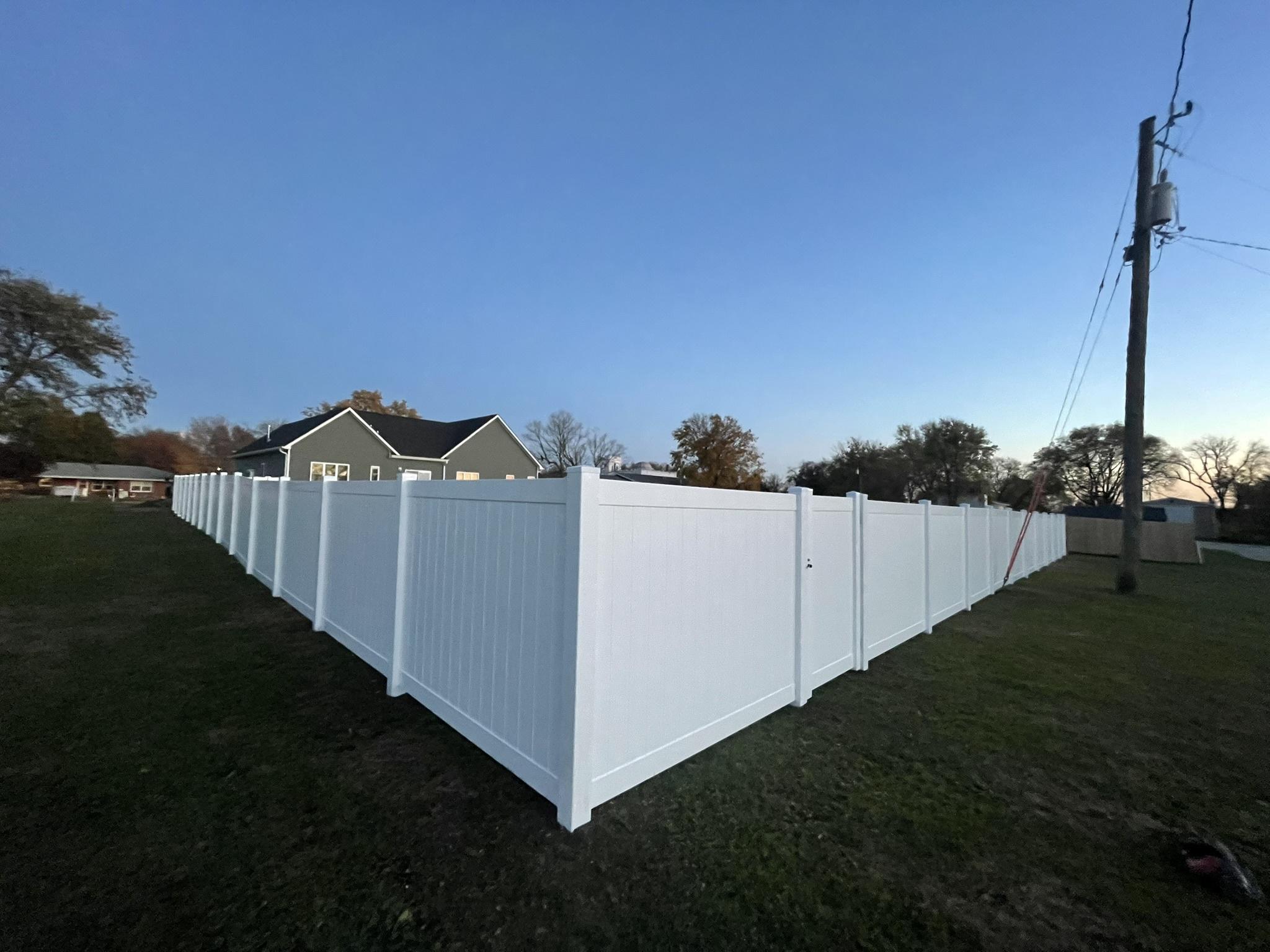 vinyl privacy fence installed by top rail fence