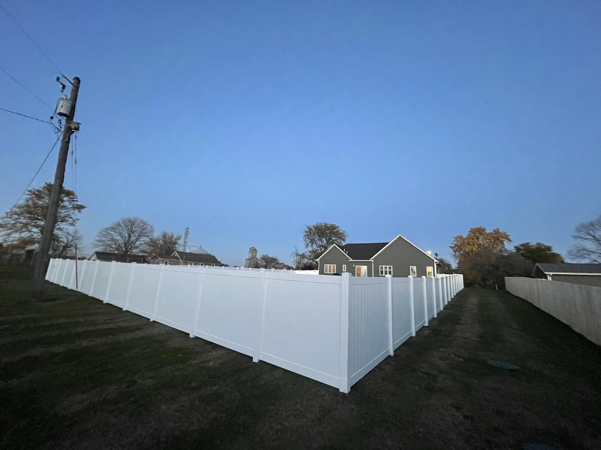 vinyl privacy fence installed by top rail fence