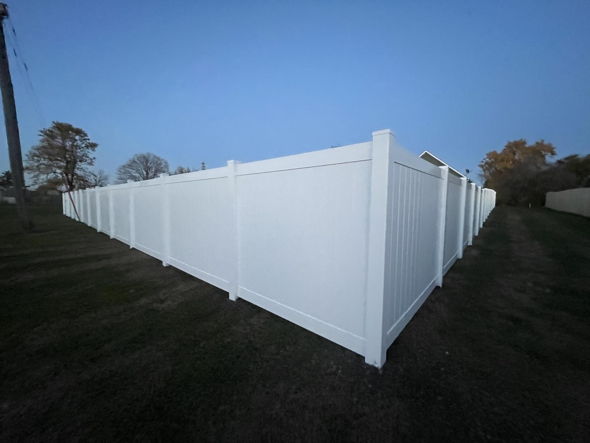 vinyl privacy fence installed by top rail fence