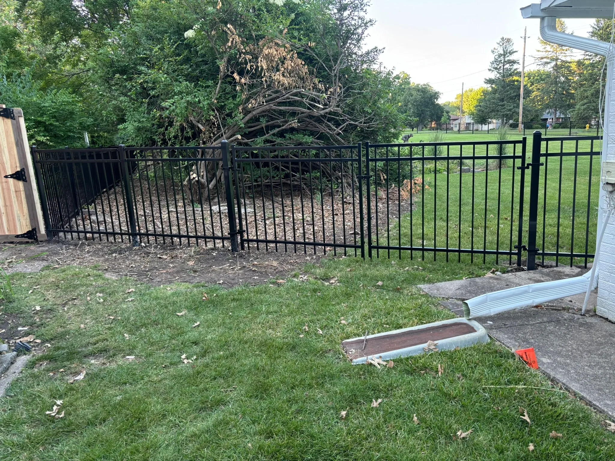 ornamental metal fence installed by top rail fence