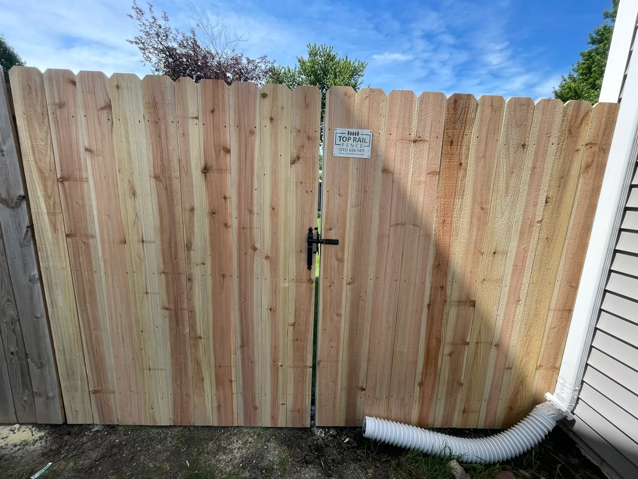 wood stockade fence installed by top rail fence