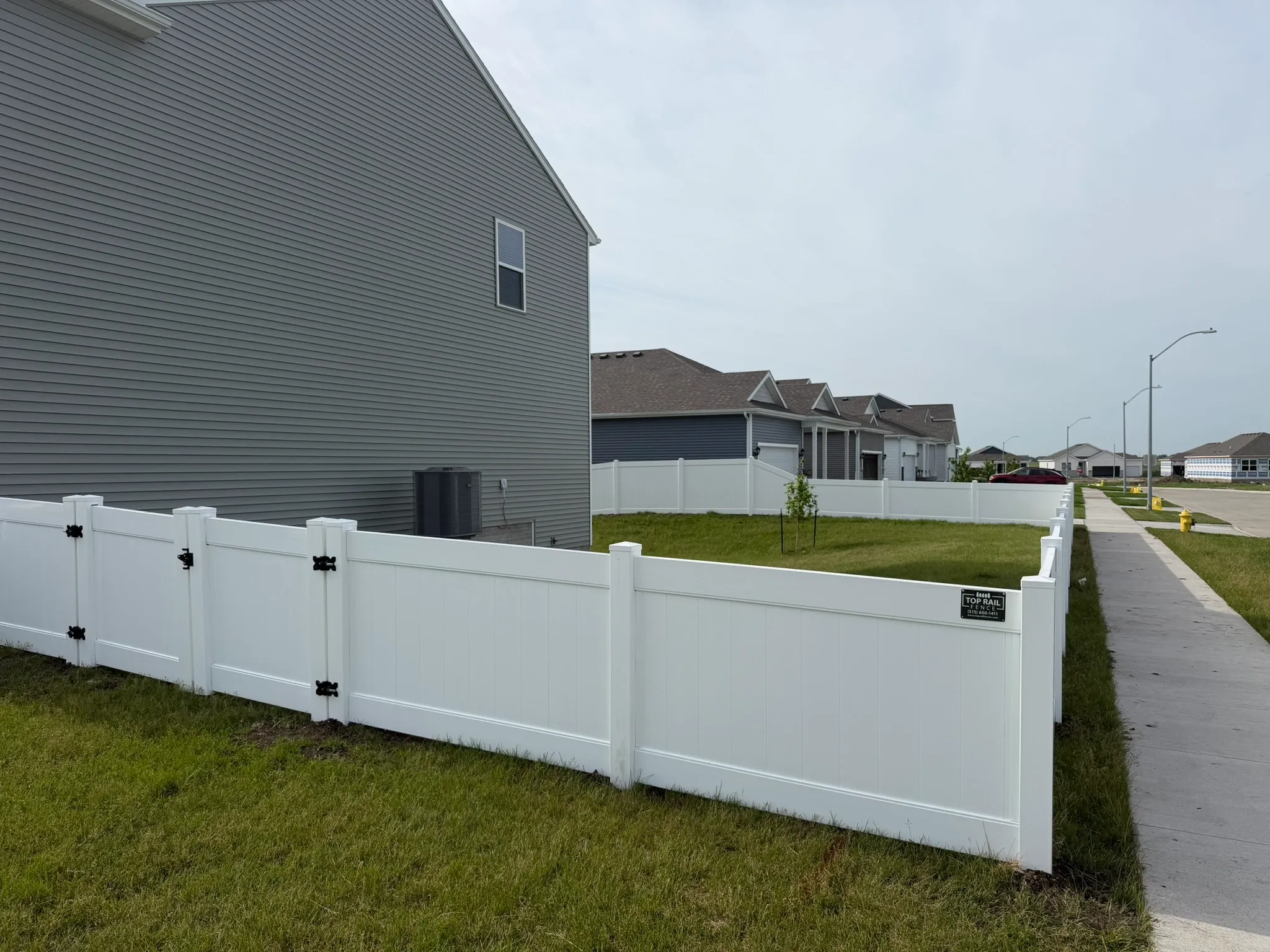 vinyl privacy fence installed by top rail fence