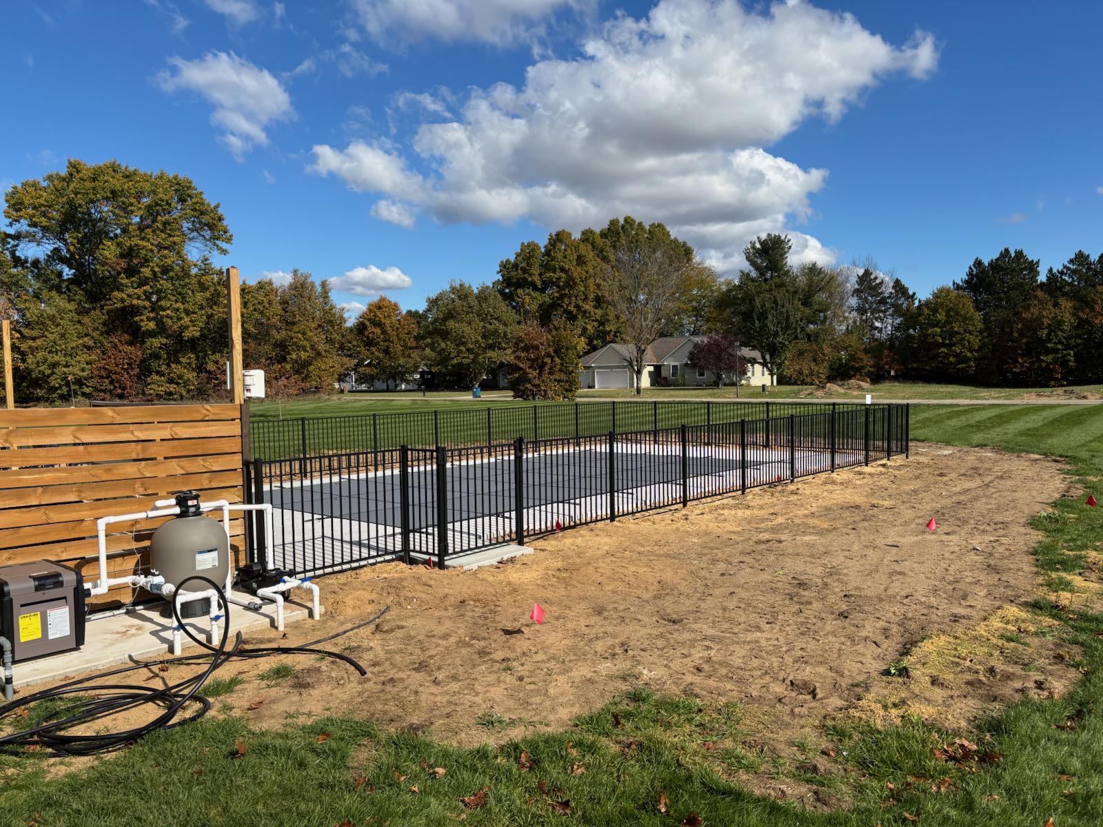 ornamental metal fence installed by top rail fence