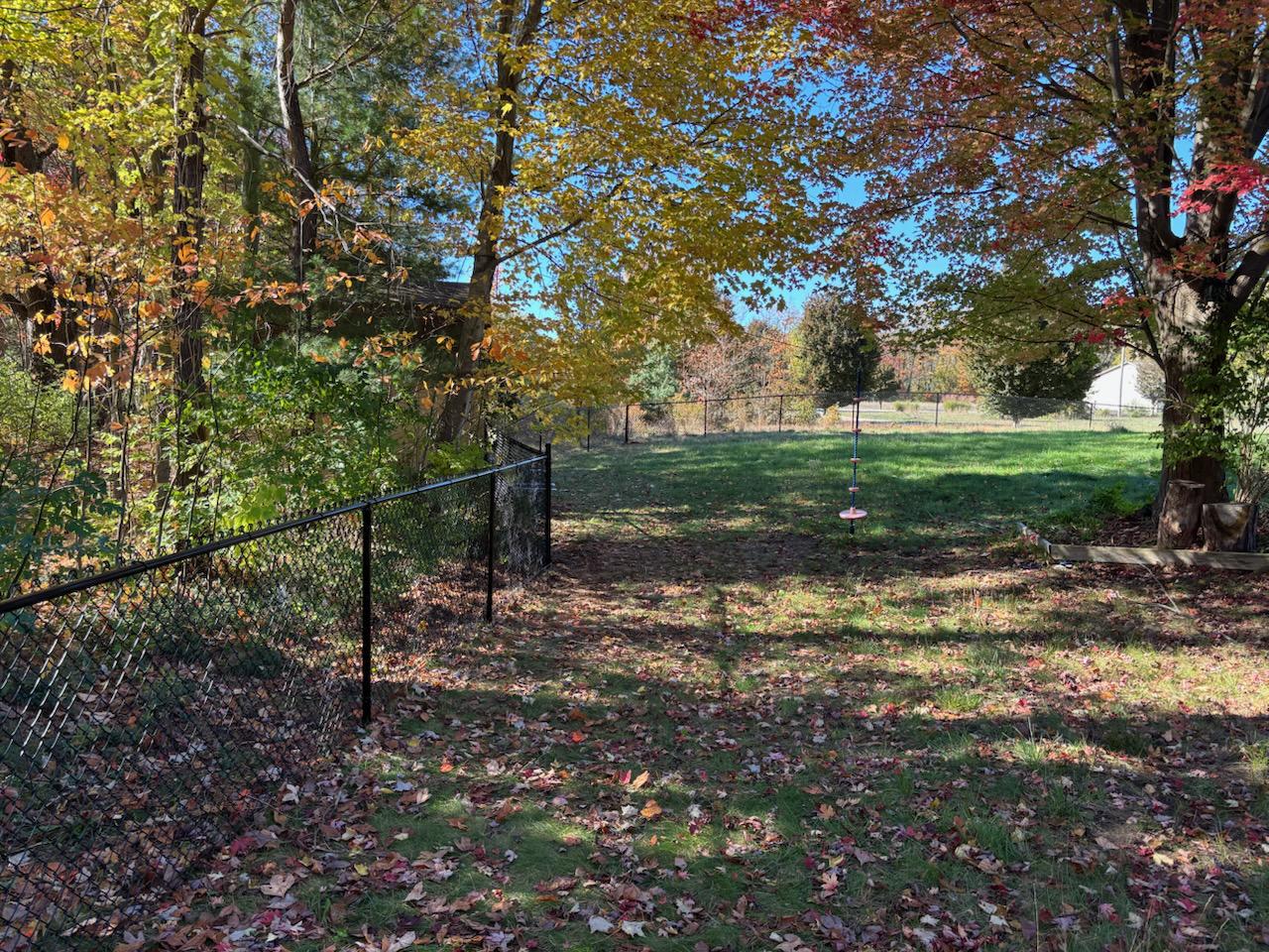 black chain link fence installed by top rail fence