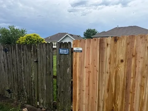 wood stockade fence installed by top rail fence