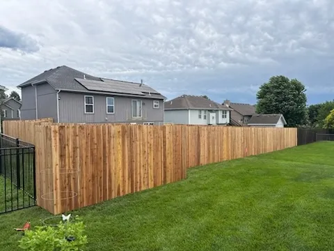 wood stockade fence installed by top rail fence