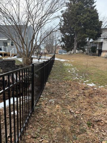 ornamental metal fence installed by top rail fence