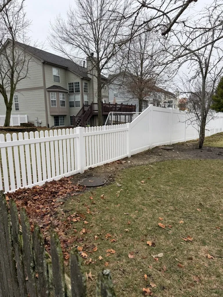 vinyl picket fence installed by top rail fence