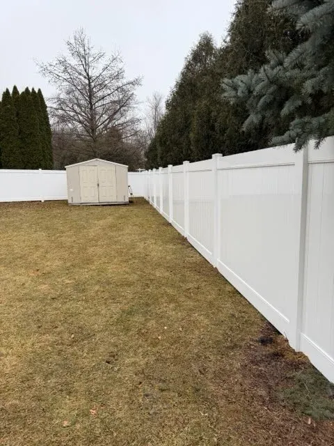 privacy vinyl fence installed by top rail fence