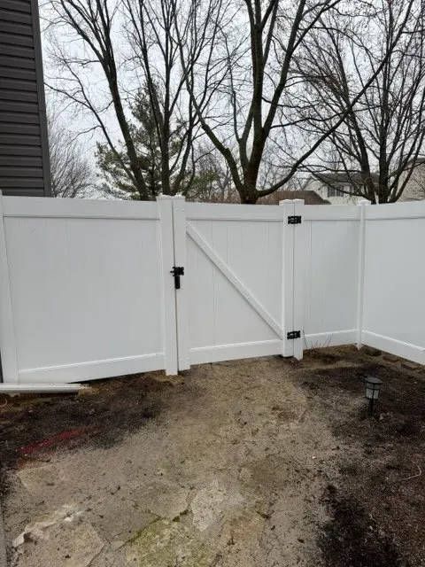 vinyl privacy gate installed by top rail fence