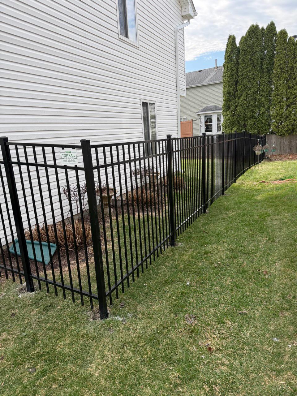  ornamental metal fence installed by top rail fence