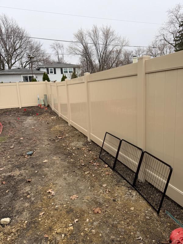 vinyl privacy fence installed by top rail fence