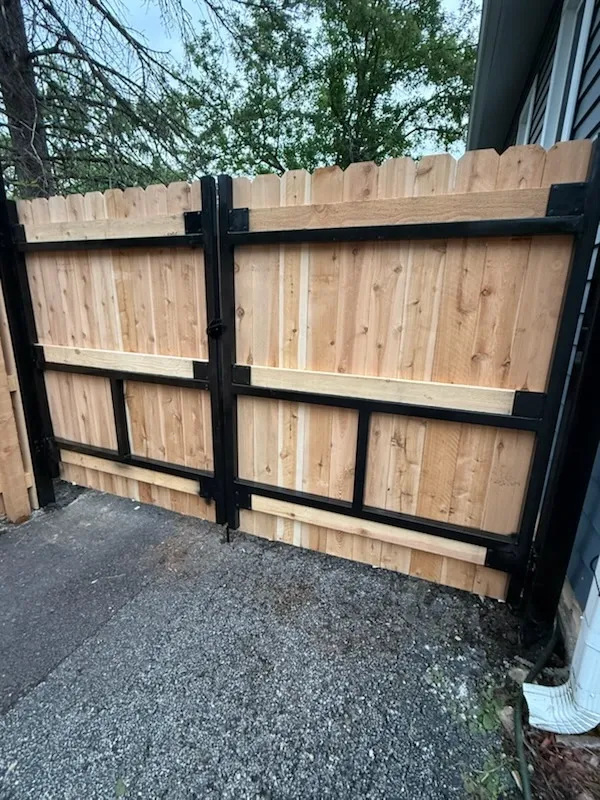 privacy gate installed by top rail fence