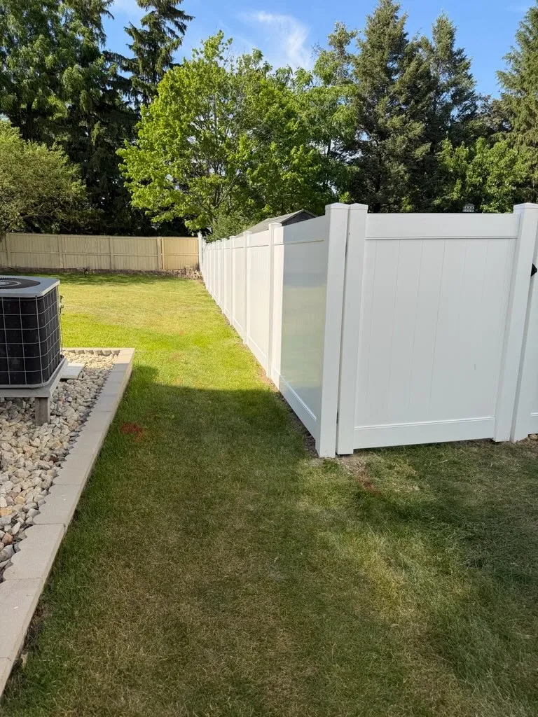 vinyl privacy fence installed by top rail fence