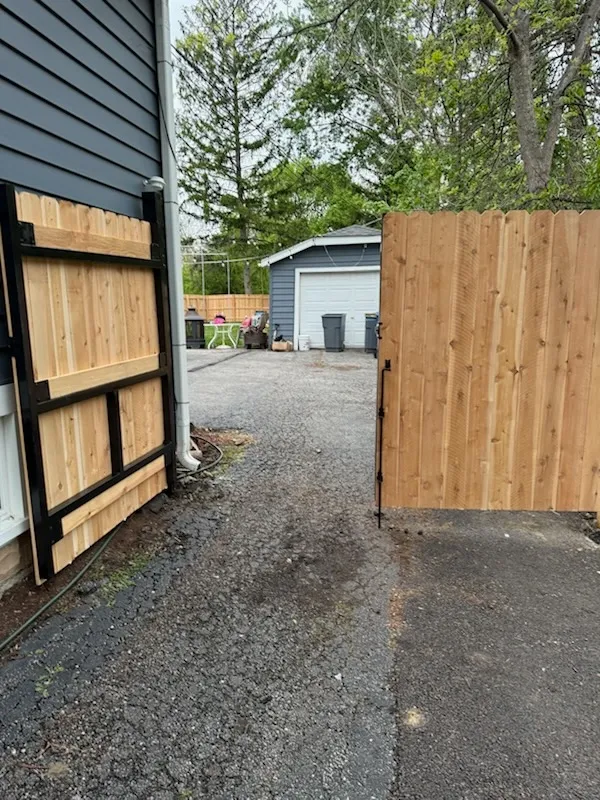 privacy gate installed by top rail fence