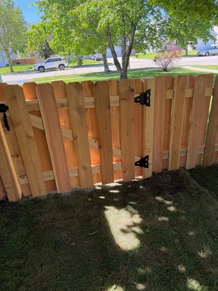 wood shadowbox fence installed by top rail fence