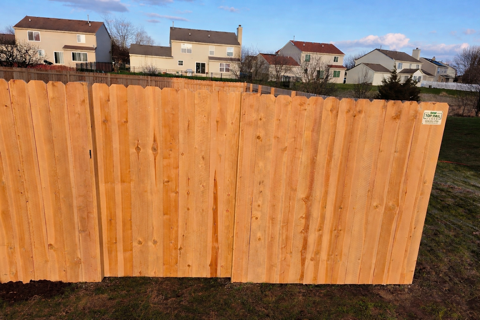 wood stockade fence installed by top rail fence