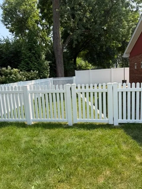 vinyl picket double gate installed by top rail fence