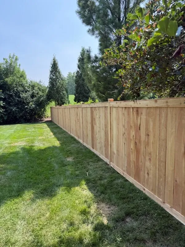 wood stockade fence installed by top rail fence